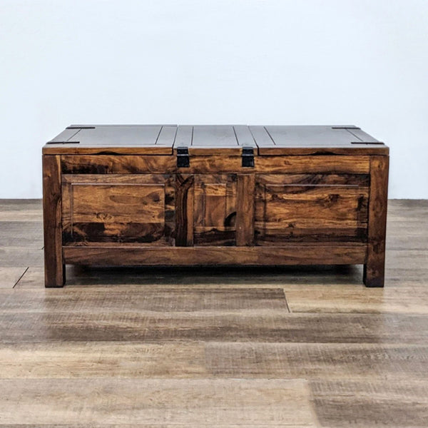 Reperch branded coffee table with closed storage top and metal hardware on a wooden floor.