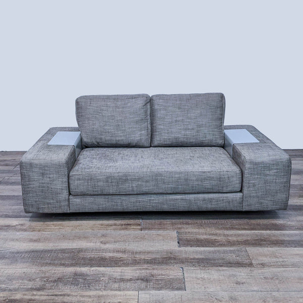 Front view of a modern 3-seat compact sofa by Viesso Furniture with block arms and inset side detailing on a wooden floor.