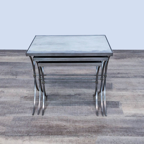 Bernhardt Furniture metal end table with a square mirrored top and straight legs on a wooden floor.
