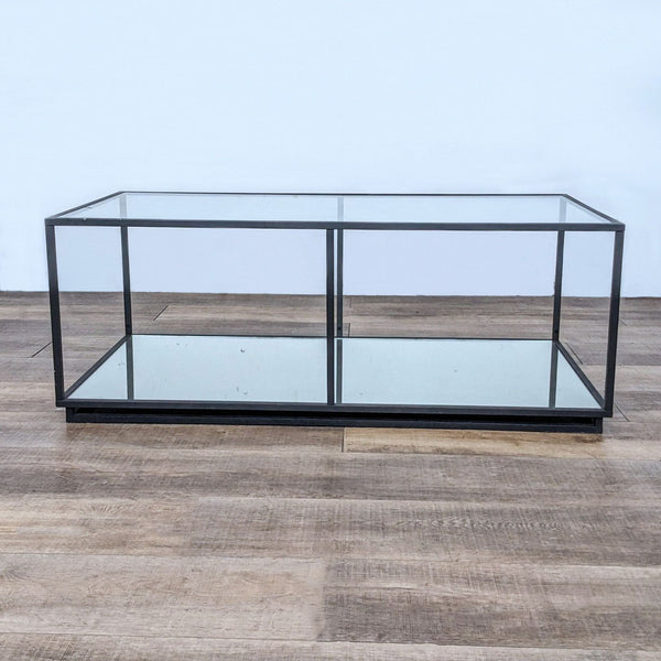 Reperch brand metal box frame coffee table with glass top on wooden floor.