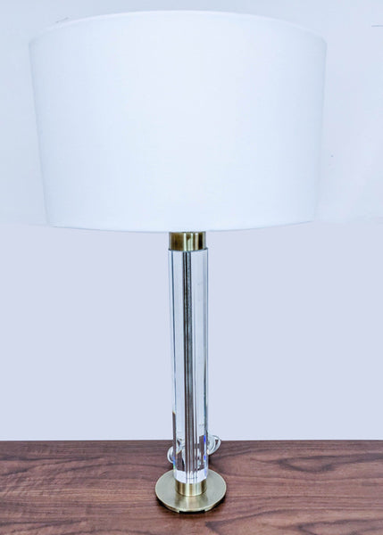 Reperch brand modern table lamp with white shade and clear cylindrical body on wooden surface.