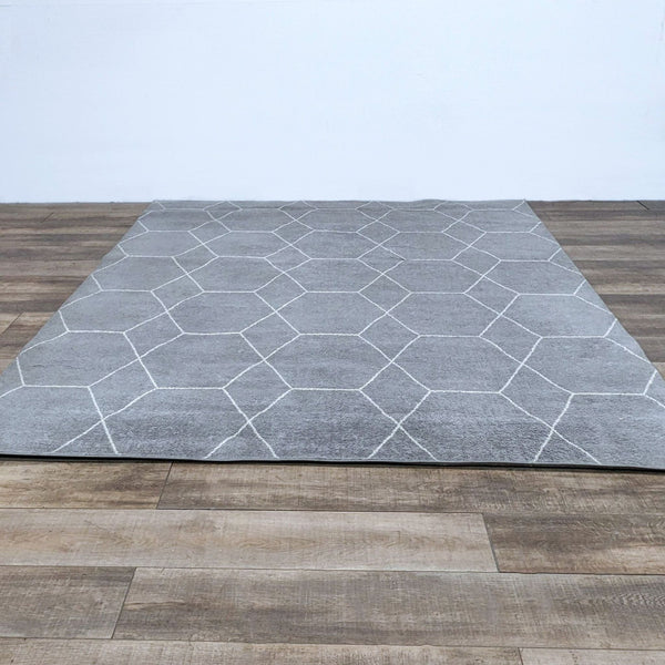 Alt text 1: Unique Loom's Trellis Frieze area rug in grey with a lattice pattern, displayed on a wooden floor, medium pile, polypropylene.