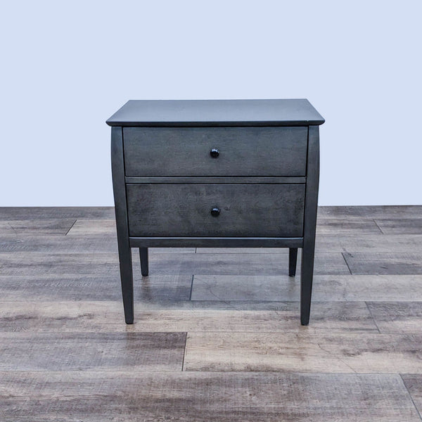 Alt text 1: Two-drawer poplar and birch veneer nightstand, with graphite pulls, by Blake Tovin for Crate & Barrel, viewed from the front.