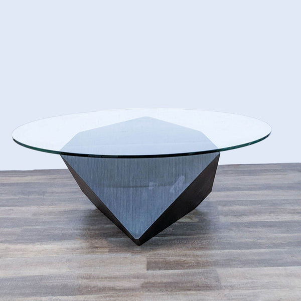 Reperch brand modern dining table with a round glass top and wooden geometric base, on a wooden floor.