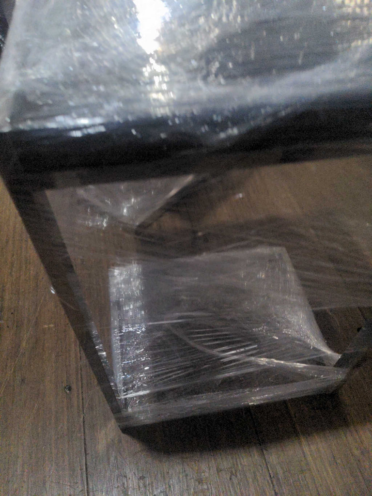 2. Round glass-top end table featuring metal legs and a compact design.