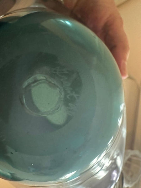 1. Closeup of the base of a Grant W. Miller art glass vase, showing the artist’s engraved signature.  
