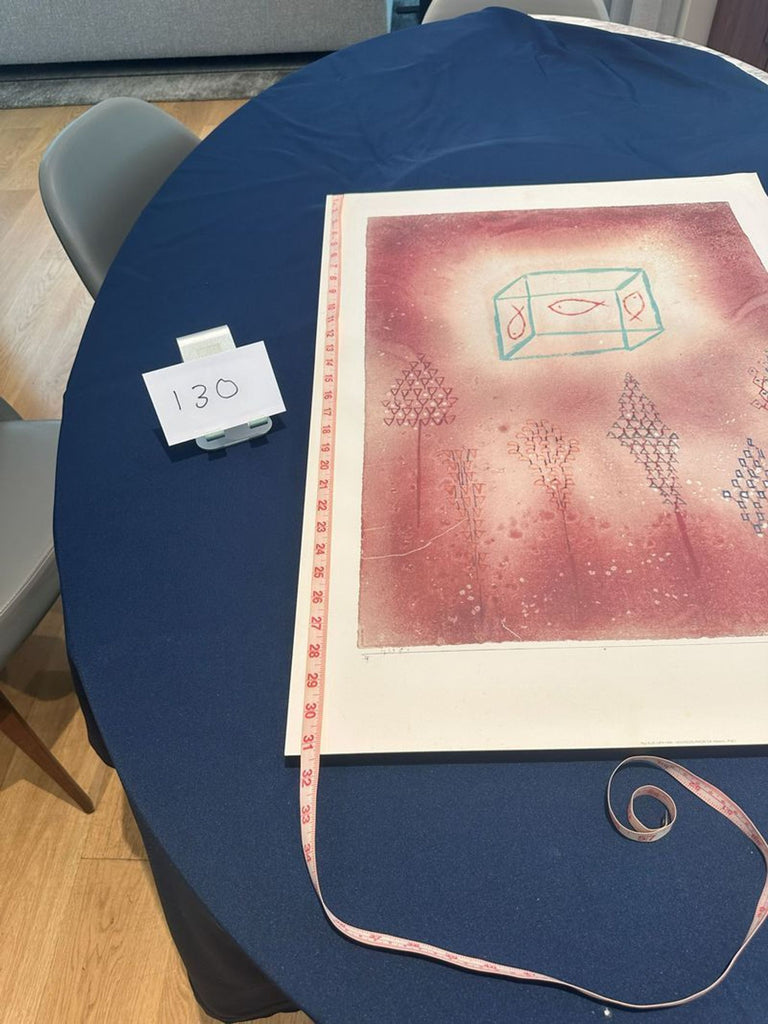 1. Art print with abstract pink design and blue geometric shapes on table, measuring tape along the edge, card marked 130.