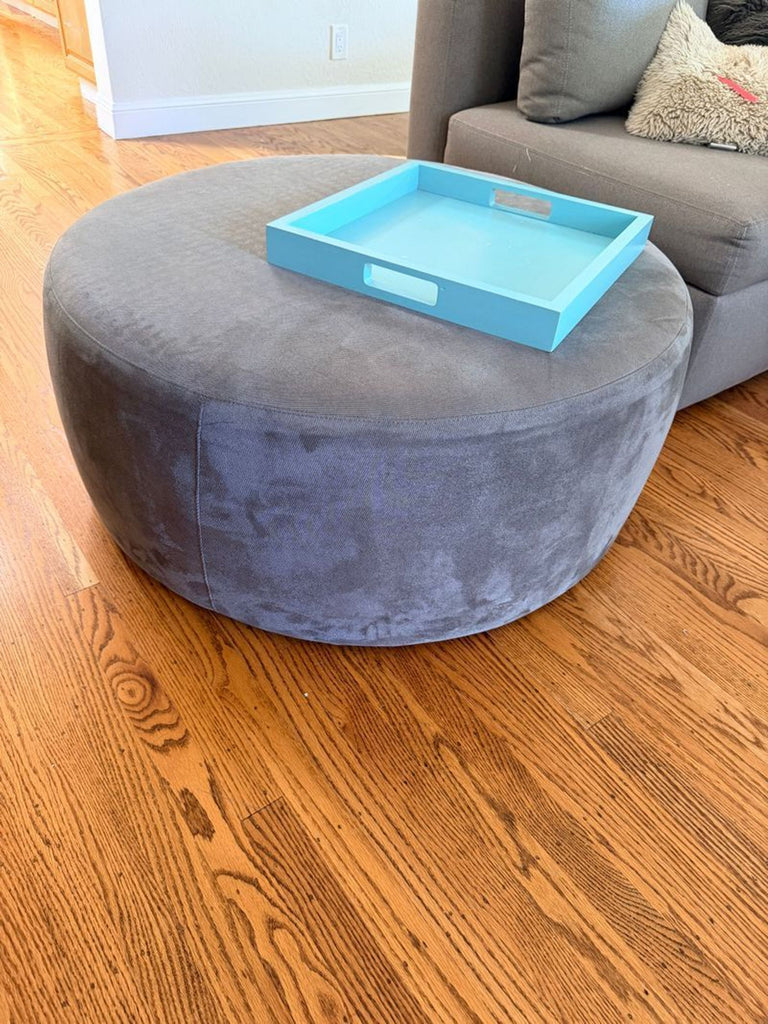 1. Room & Board Lind ottoman with sleek cushion top, modern design, and sturdy base; originally priced at $600.  