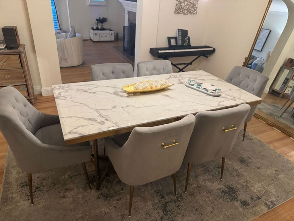 Wayfair brand dining set with a marble tabletop and coordinated chairs.