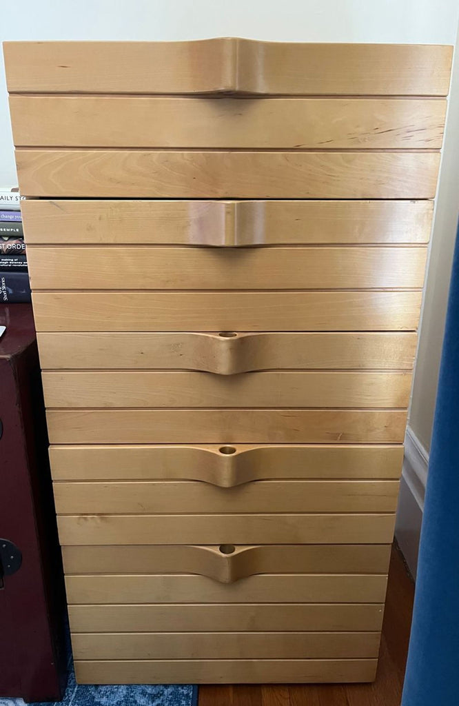 1. Modern Scandinavian dresser with four spacious drawers, featuring minimalist design and light wood finish.  