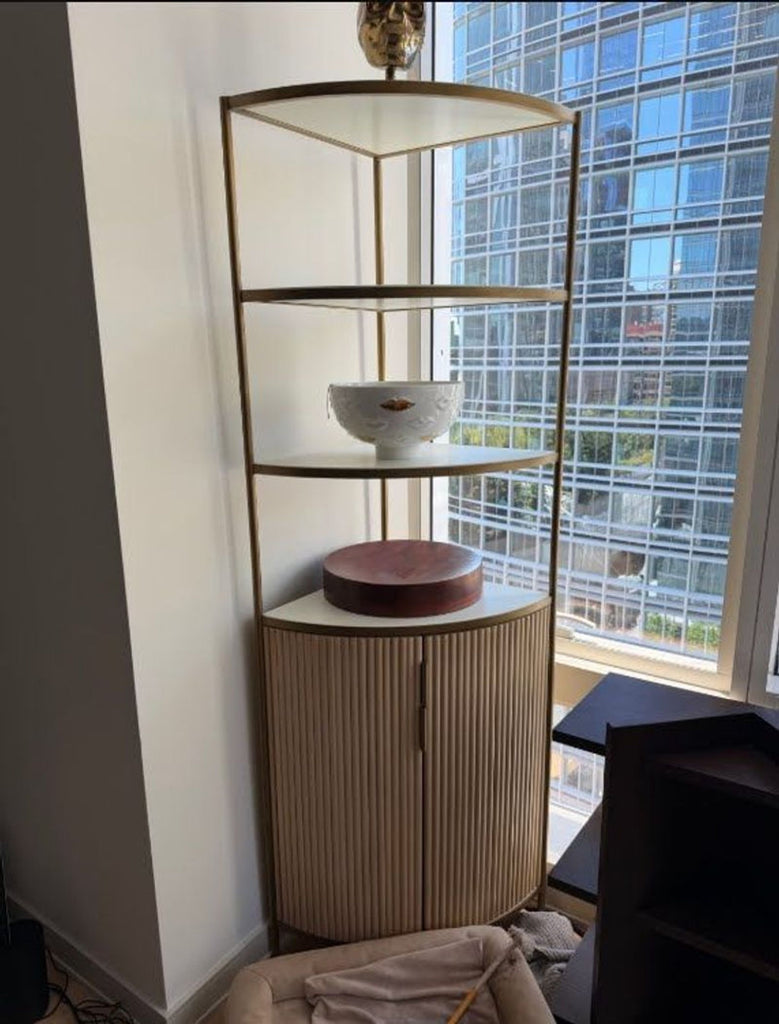 1. Crate & Barrel Fayette corner bookshelf cabinet with multiple shelves and a lower cabinet for storage.