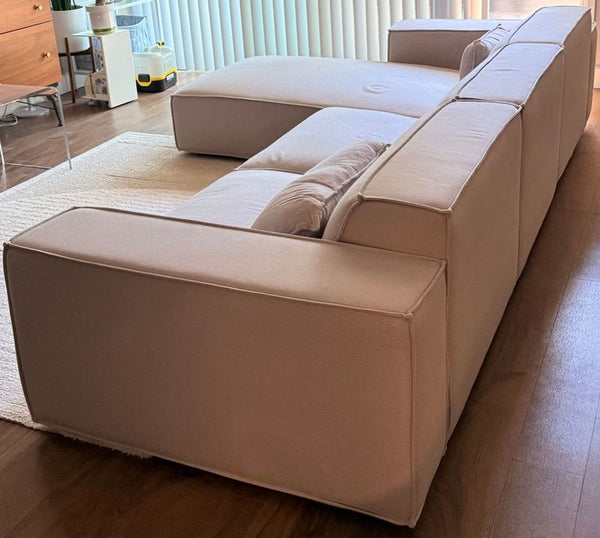 Modern Porter sectional sofa, light fabric, minimal pilling, from 2022, shown in a living room setting.