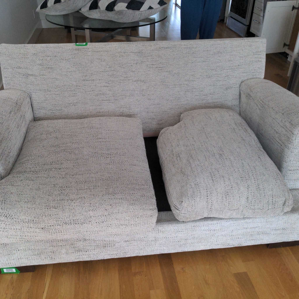 2. Reperch loveseat in light gray fabric with one removed seat cushion and armrests, pillows set aside.
