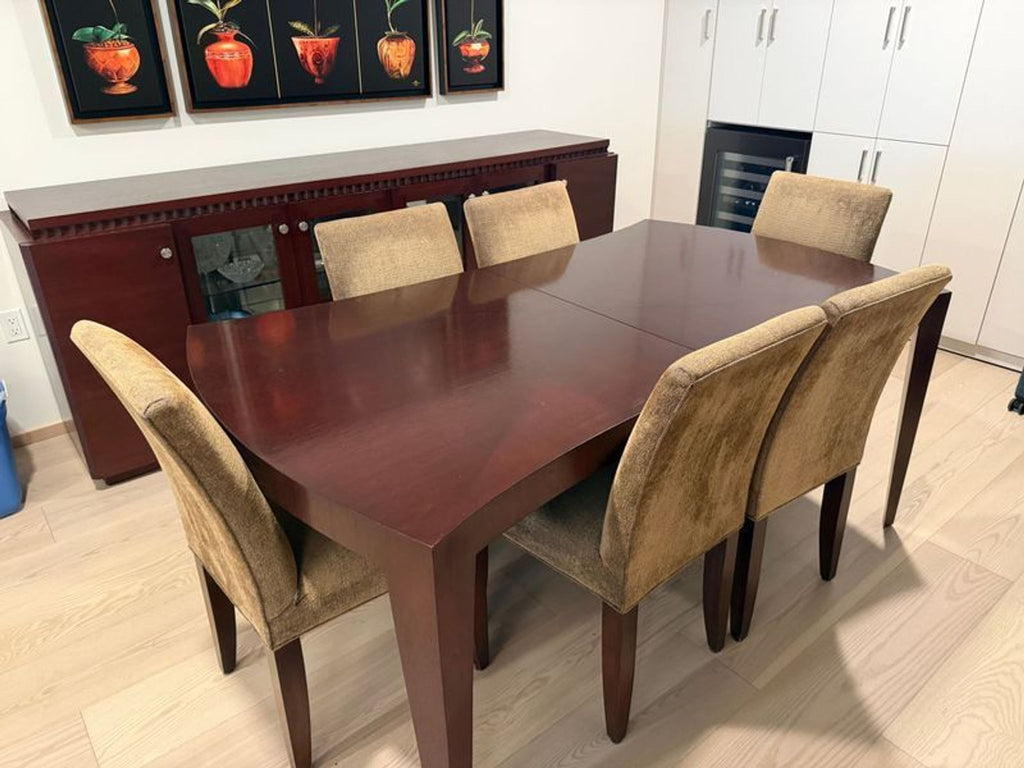 1. Rectangular dark wood dining table with six tan upholstered chairs in a modern dining room setting.
