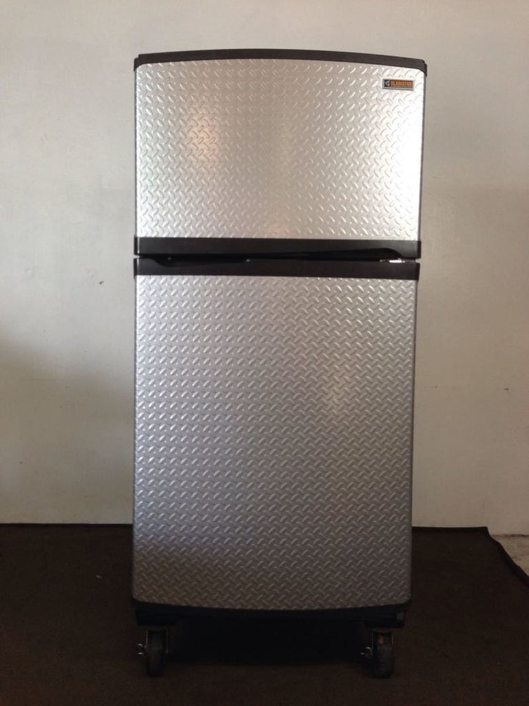 2. Front view of a Whirlpool Chillerator refrigerator on wheels, featuring reversible steel doors and modern handles.