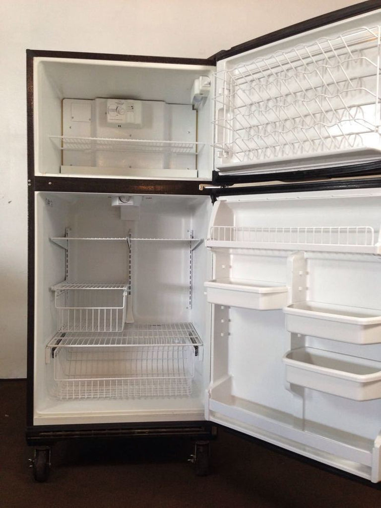 3. Open Whirlpool refrigerator showing spacious fridge and freezer compartments with adjustable shelves and door bins.
