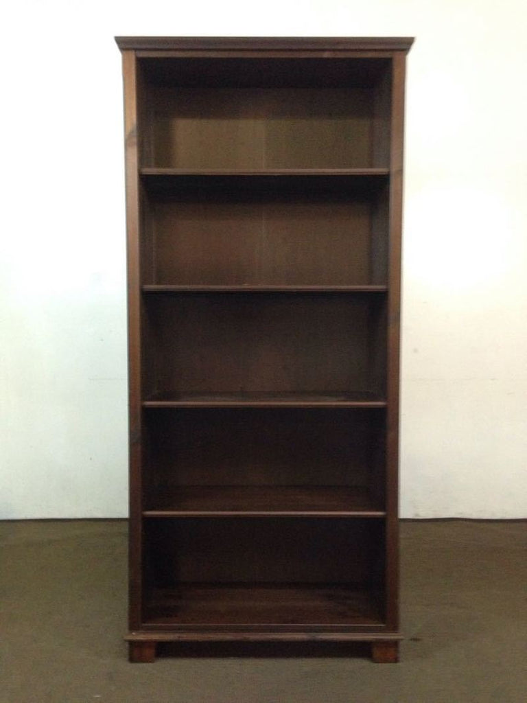 1. Dark brown IKEA bookshelf with plywood back and four shelves, seen against a plain background.