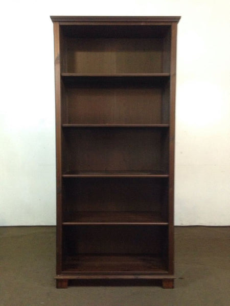 1. Dark brown IKEA bookshelf with plywood back and four shelves, seen against a plain background.