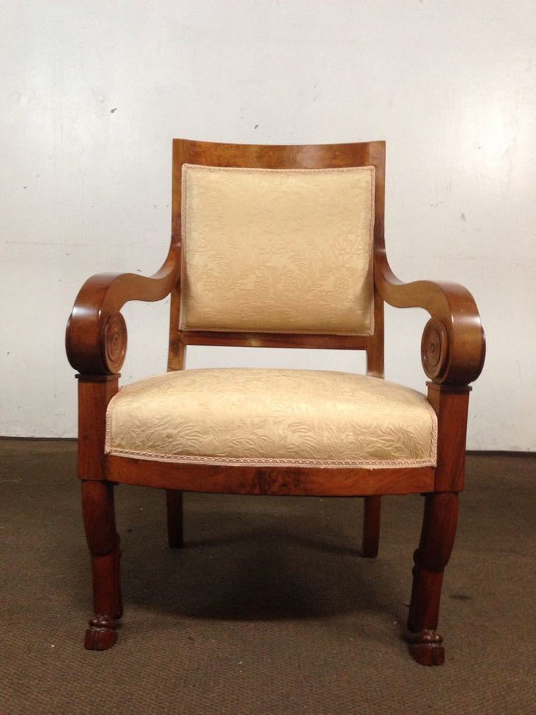 1. Wooden chair with scrolled arms, cream textured upholstery, front view; Reperch brand chair.
