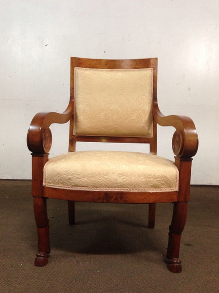 1. Wooden chair with scrolled arms, cream textured upholstery, front view; Reperch brand chair.
