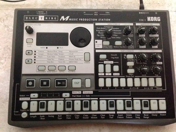 1. Top view of Korg ElecTribe EM-1 music production station showing knobs, buttons, and display.
