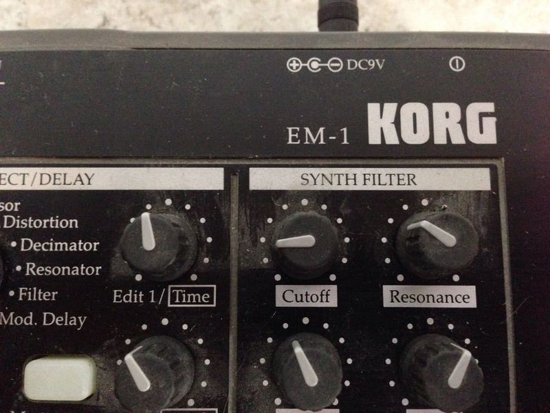 3. Close-up of Korg EM-1 control panel, focusing on effect and synth filter adjustment knobs.