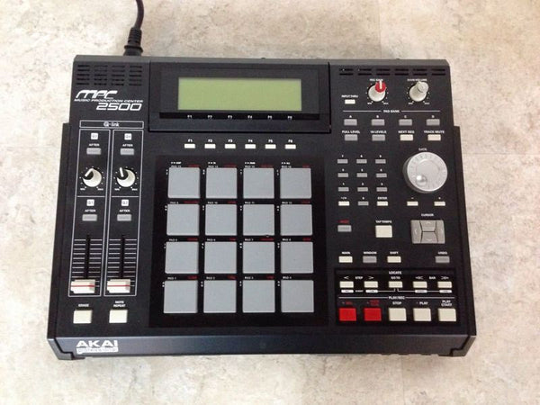 1. Top view of Akai Professional MPC2500 Music Production Center showing pads, knobs, and controls for audio equipment.