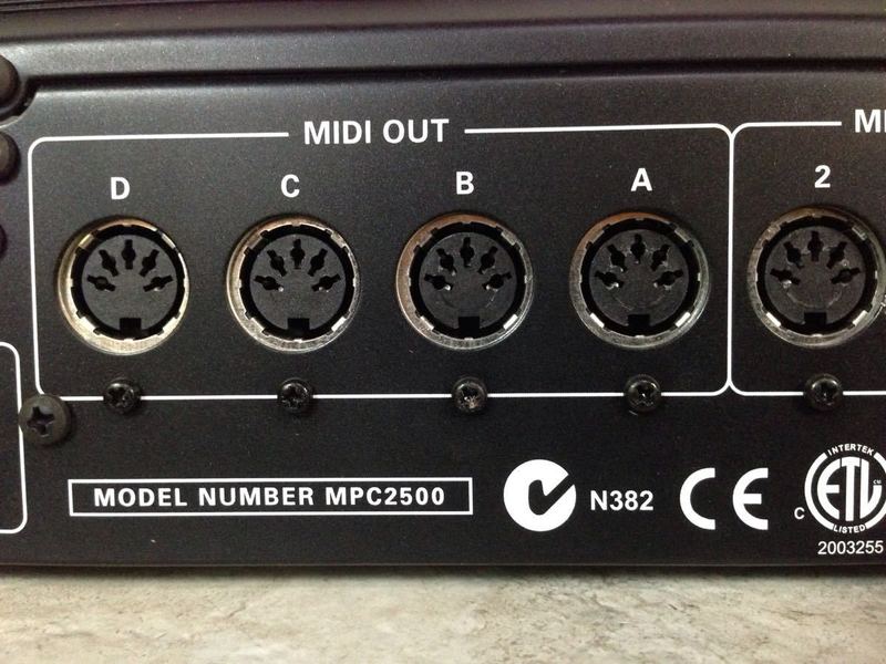 3. Rear panel of Akai MPC2500 with four MIDI OUT ports labeled A-D and model information for audio equipment.
