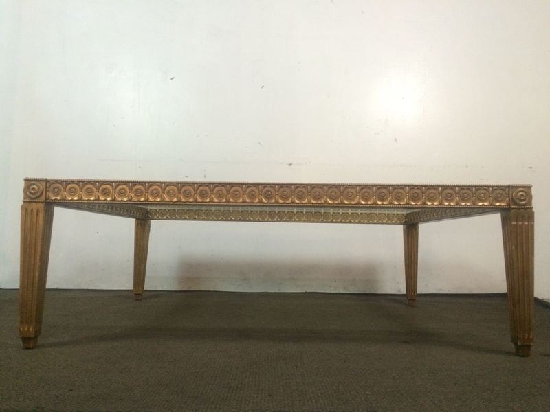 2. Side view of a square Reperch coffee table, featuring rosette details around the edge.