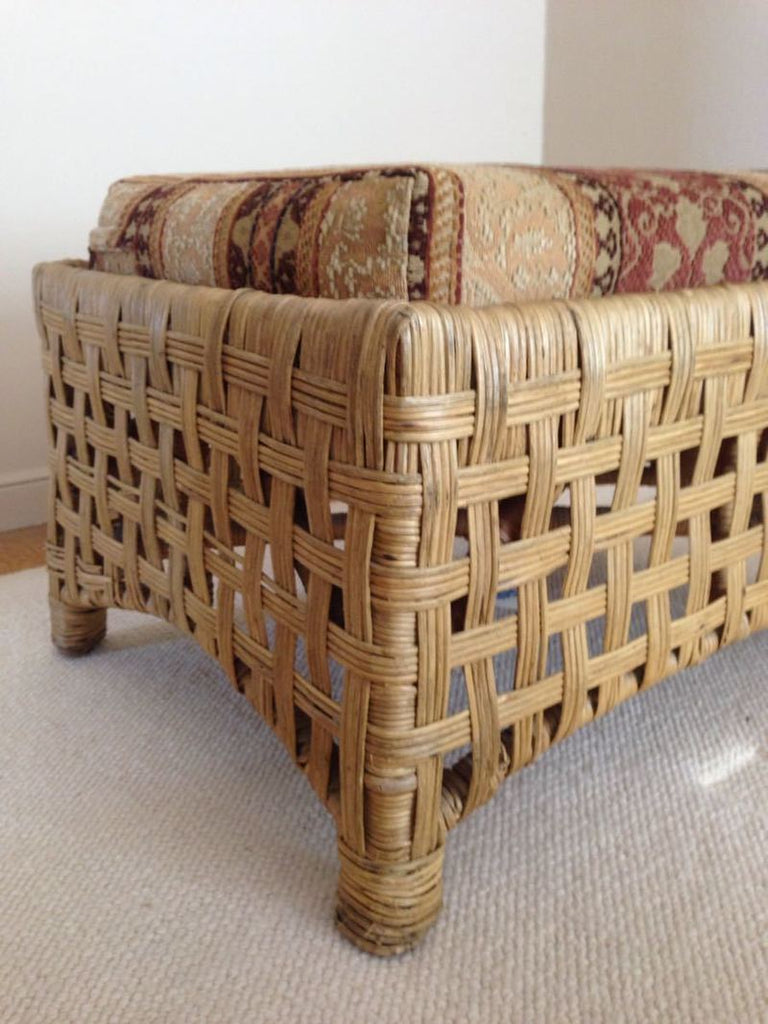 3. Angled close-up of a Reperch chair, highlighting woven structure and foliate print on the cushion.