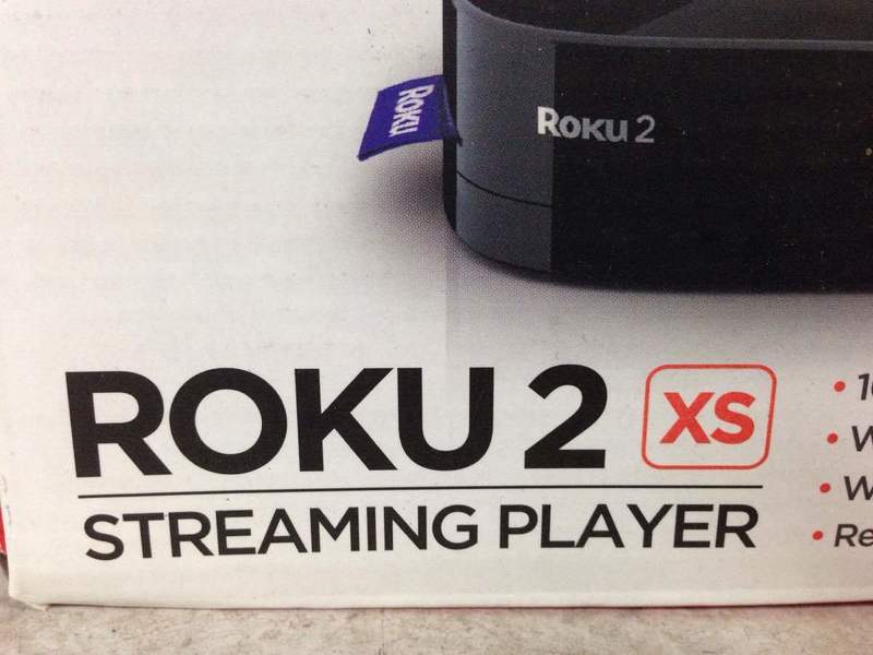 2. Close-up of the Roku 2 XS Streaming Player logo and branding on the product packaging.