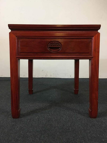 1. Front view of a vintage Chinese rosewood end table by Reperch, showcasing a single carved drawer.