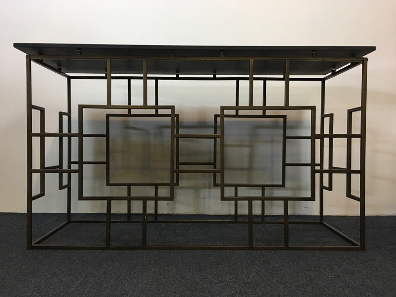1. Console table with geometric metal frame and glass top, featuring bold square patterns, by Reperch.  