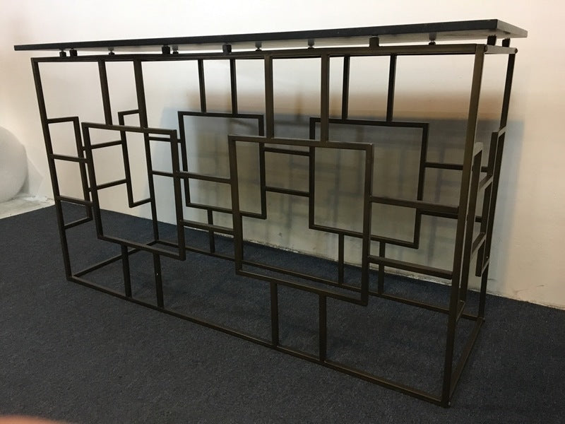 3. Angled side view of Reperch console table showcasing open metal square design and lacquered top.