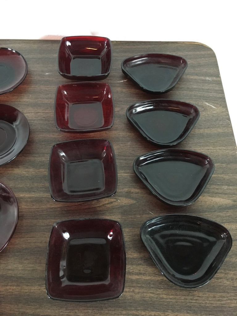 3. Group of assorted red glass square and triangular bowls by Anchor Hocking, displayed on a table.