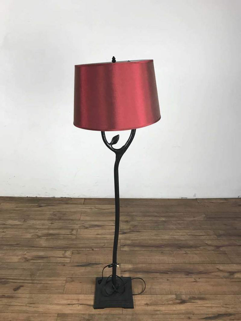 1. Reperch floor lamp in great condition with a red lampshade and black stand on a wooden floor.  
