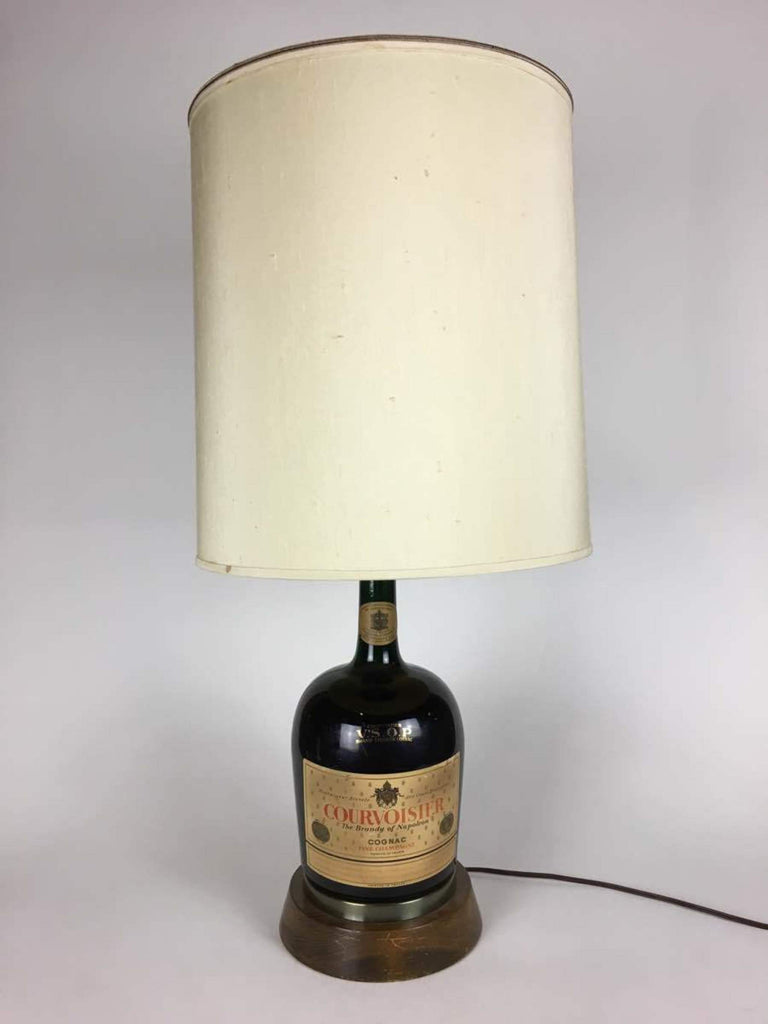 1. Vintage 1979 Reperch lamp made from a Courvoisier cognac bottle with a tall, cream lampshade.