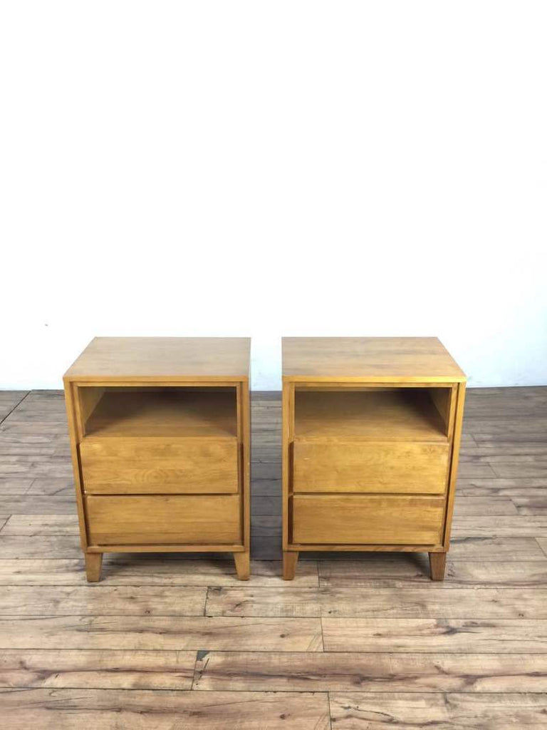 3. Set of two wooden Conant Ball end tables, each with a top shelf and two drawers, pictured side by side.