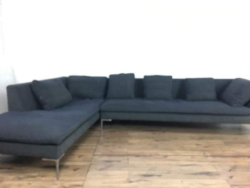 Modern Italian L-shaped B&B Italia sofa, raised on metal base, with multiple back cushions.  