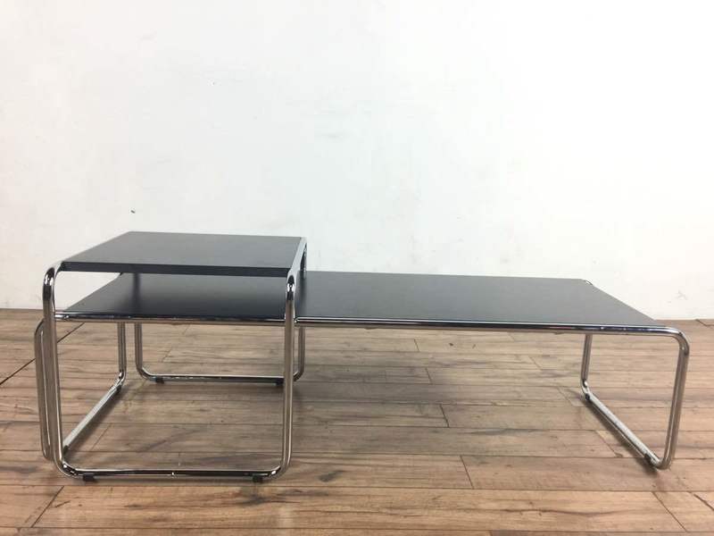 2. Minimalist Design Within Reach coffee table set with black tops and shiny metal legs, shown from the front.