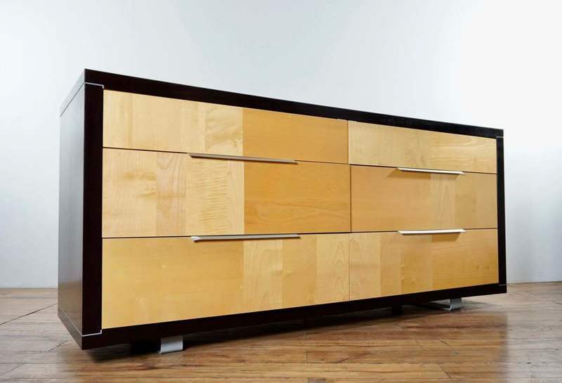 2. Italian-made Reperch dresser with black lacquer frame, metal feet, and six wooden drawers, angled view.
