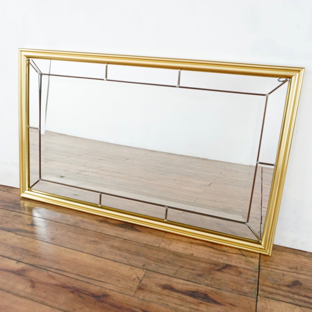 2. Angled view of a vintage Reperch mirror from the 1980s featuring a gold-toned gilded frame.