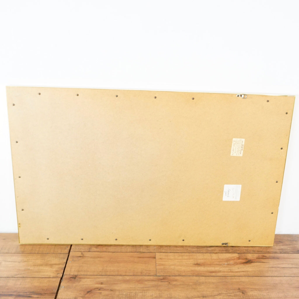 3. Back view of the Reperch mirror showing plain wooden backing and attached hardware for mounting.