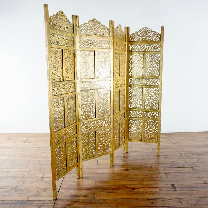 2. Handcrafted Reperch room divider with floral cut-out wood panels, Indian design, freestanding on wood floor.