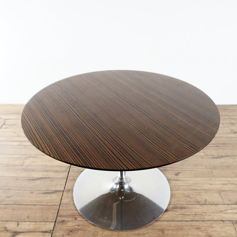 3. Top view of Calligaris Macassar dining table highlighting striped wood grain and sleek chrome pedestal base.