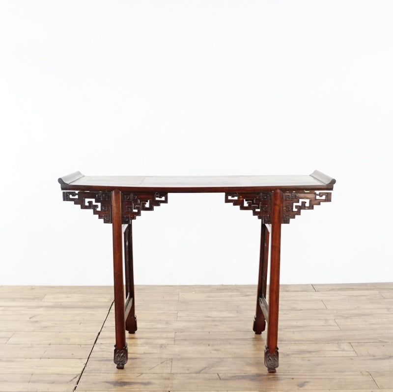 2. Reperch rosewood console table, featuring ornate carving, viewed from the front against a white background.