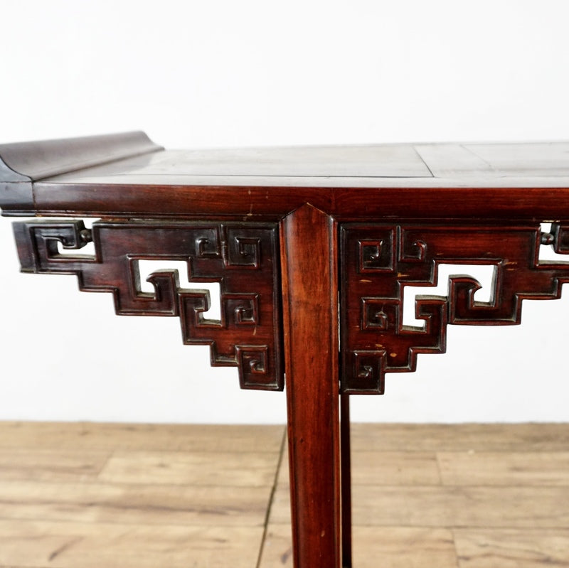 3. Close-up of elaborate carved details on a rosewood side table by Reperch, highlighting craftsmanship.