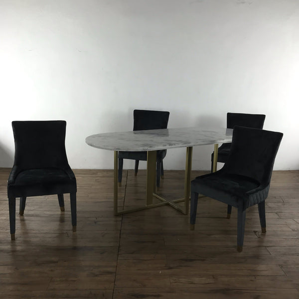 1. Reperch dining set with marble-top oval table, brass iron base, and four black chairs with brass feet.