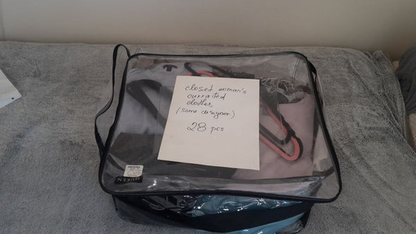 1. Transparent storage bag filled with Reperch women's clothes, labeled with "curated clothes" and "28 pcs."