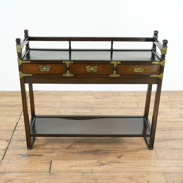 1. Reperch side and console table with brass fittings, three drawers, and lower shelf, in dark wood finish.